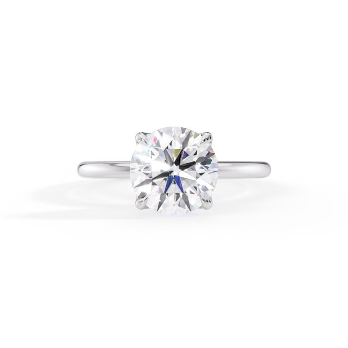 round cut moissanite solitaire engagement ring in 14k white gold