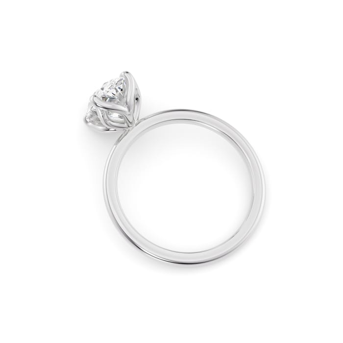 Silver ring with a diamond on a white background