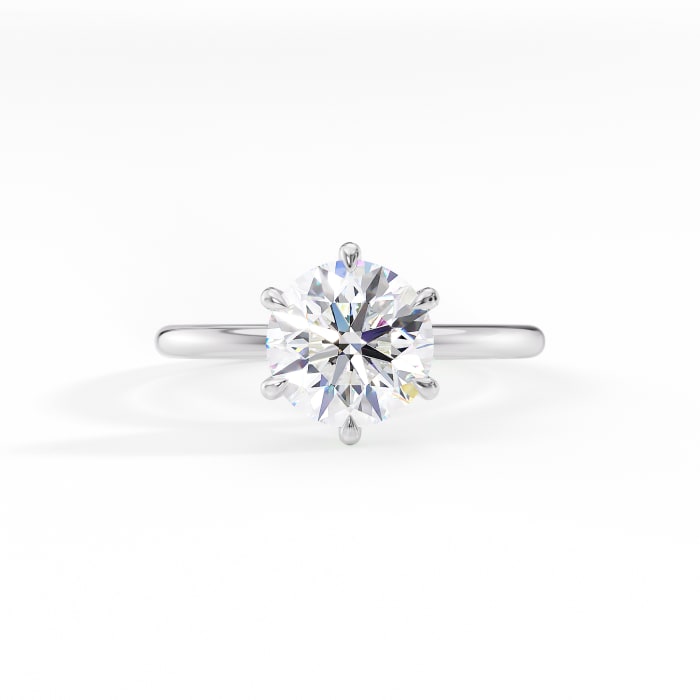 round cut moissanite six prong engagement ring in 14k gold