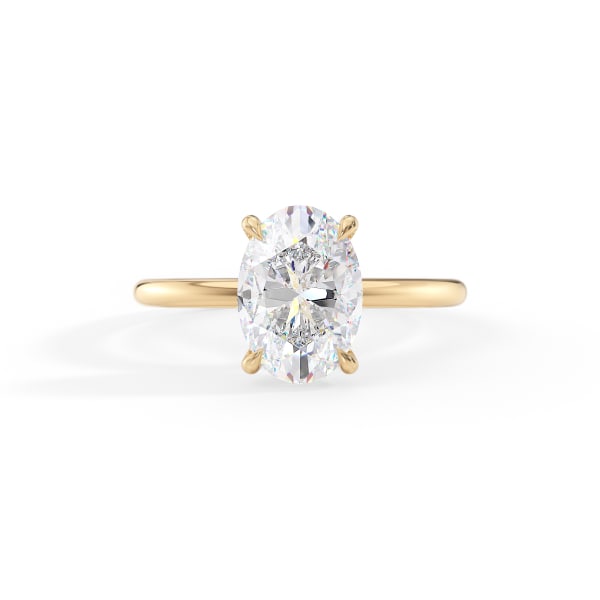 Gold ring with a large diamond on a white background