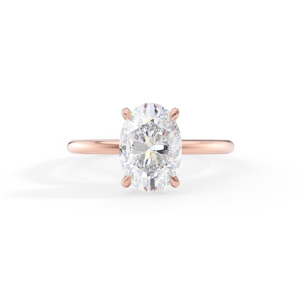 Rose gold ring with a large diamond on a white background