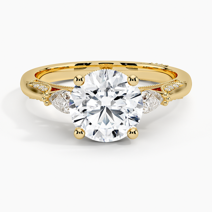 Round Brilliant Cut Diamond Engagement Ring with Pear Side Stones, plit Shank Milgrain Band