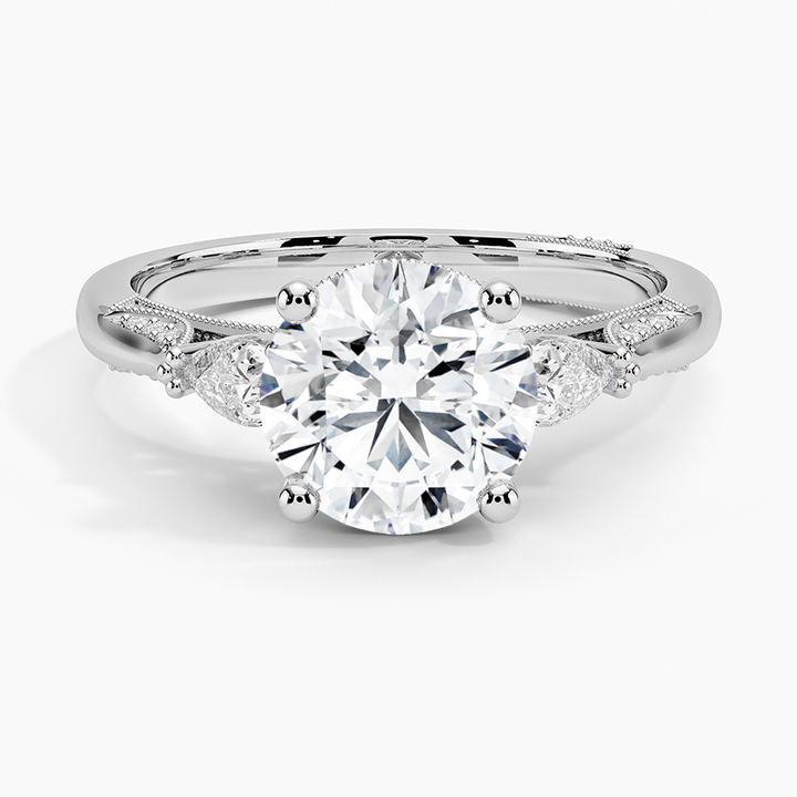 Round Brilliant Cut Diamond Engagement Ring with Pear Side Stones, plit Shank Milgrain Band