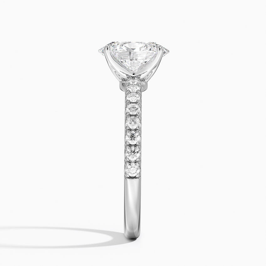 Diamond ring with a central stone and smaller stones on a white background