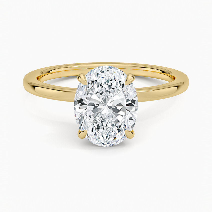 oval cut moissanite solitaire engagement ring in 14k yellow gold
