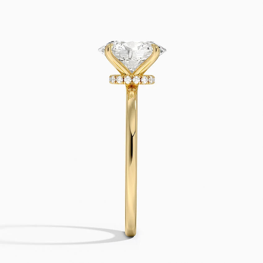 Gold ring with a diamond on a white background