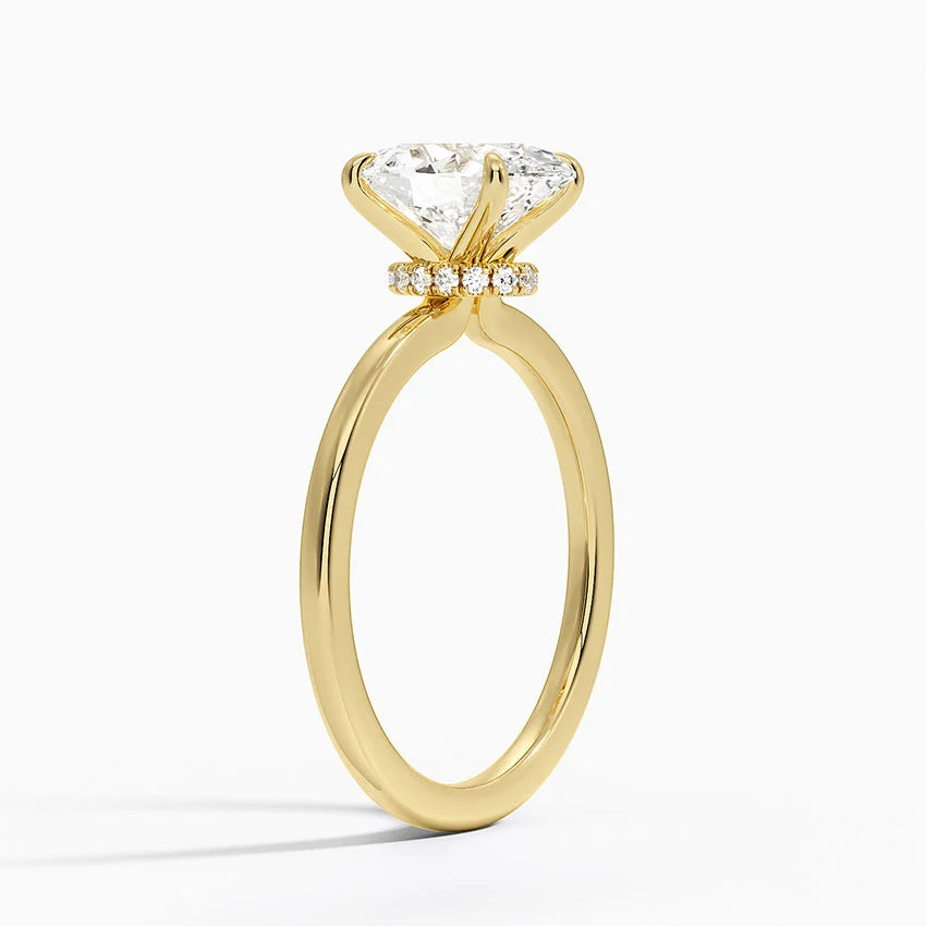 Gold ring with a diamond on a white background